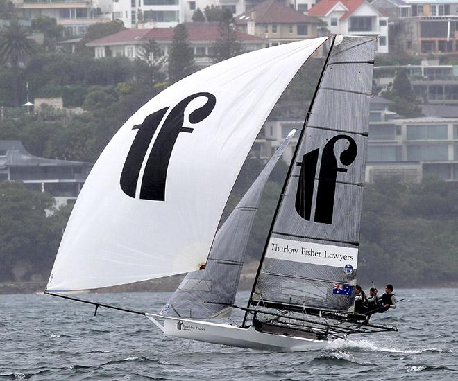 Thurlow Fisher's crew look comfortable as they race up the harbour in a strong southerly © Frank Quealey